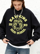 Felpa girocollo Stranger Things Hawkins High School tigre