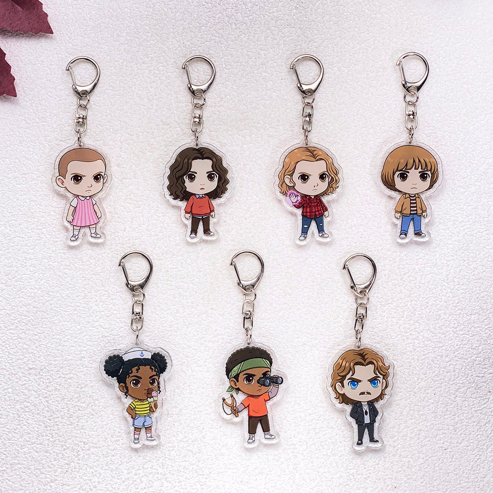 Lot de 7 porte-clés acryliques Stranger Things personnages dessinés vu de face